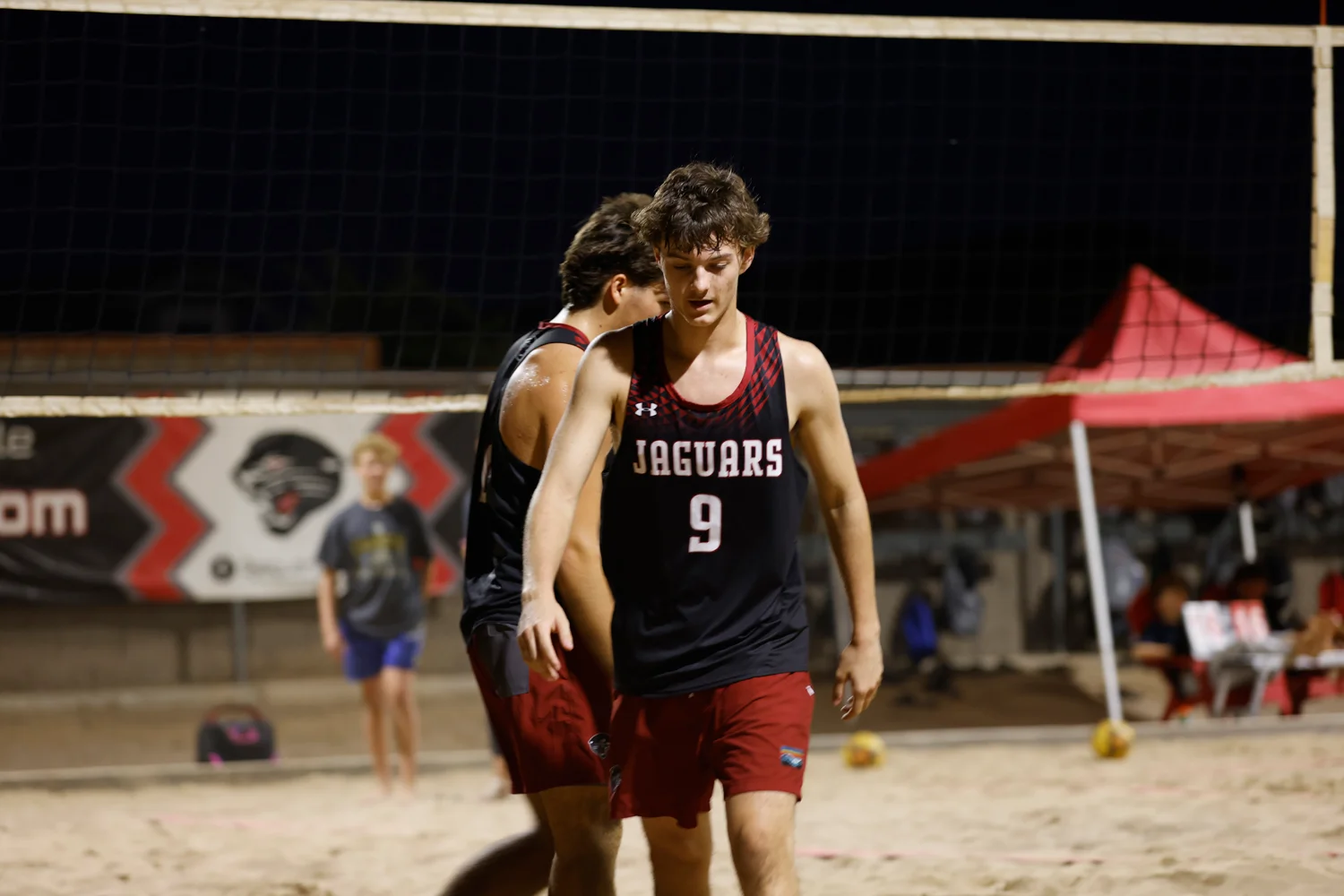 Headed back to serve the ball